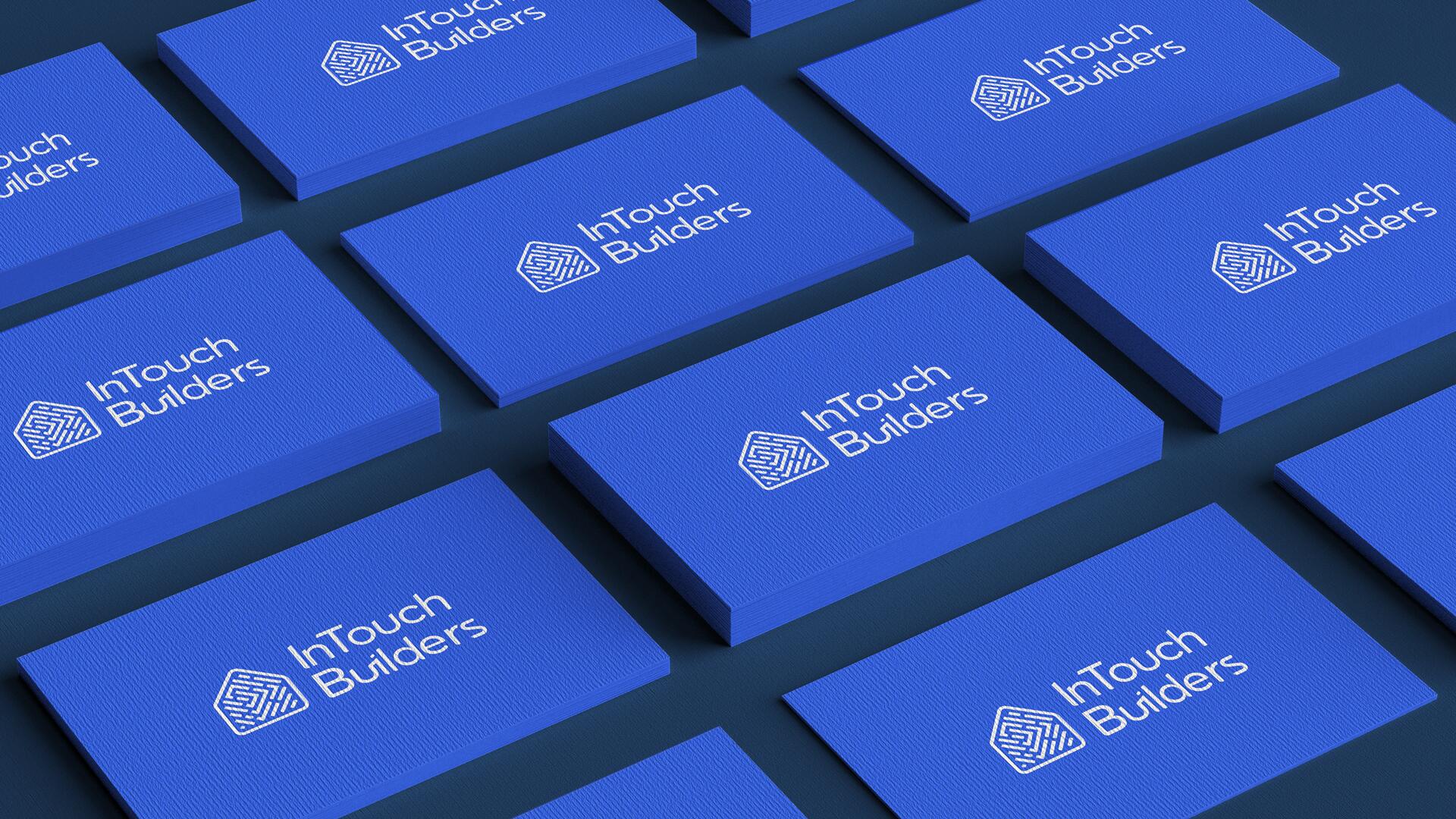 FIG.09 — a repeating array of the blue business card shot at an angle, testing the lockup at small scale